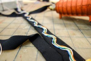 Wires in a strip of black fabric