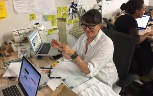 a designer sits at her desk