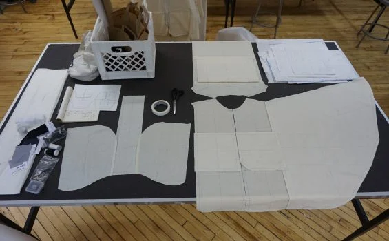 Several pattern pieces are laid out on a table.