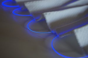 fibers of blue light in a 3D smart knit textile