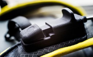 black plastic switch on harness strap