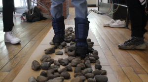 Model walks on rocks with moon boots