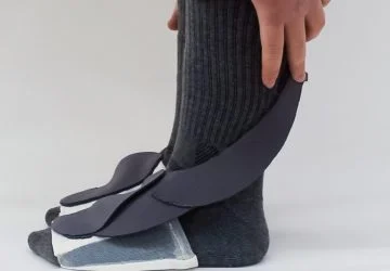 model in grey socks with foot sensors