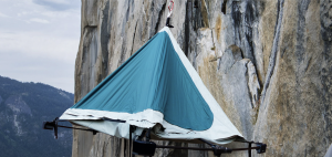 blue climbers Camp tent on a cliff face