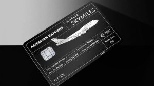 The black Delta SkyMiles AmEx floats on a dark background